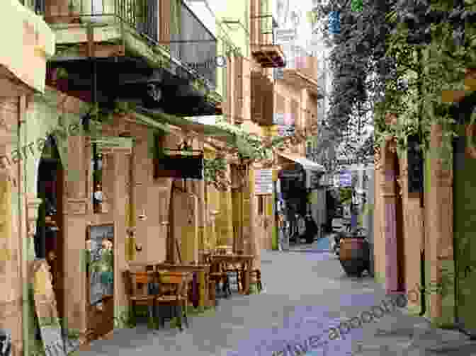 A Bustling Street In Chania Town, With Whitewashed Buildings, Cobblestone Streets, And A Lively Atmosphere. Postcards: A Visual Escape Through Chania Crete