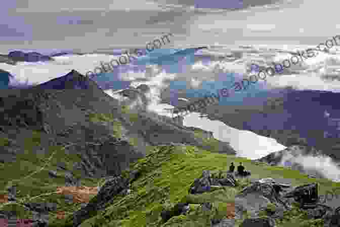 Hikers Marveling At The Breathtaking Views Of Snowdonia's Peaks From The Snowdonia Coast Path. The Ceredigion And Snowdonia Coast Paths: The Wales Coast Path From Porthmadog To St Dogmaels (Cicerone Guides)